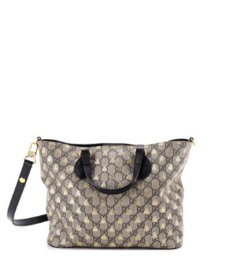 Бывшая в употреблении маленькая мягкая сумка-тоут Gucci с откидным верхом из холщовой ткани черного цвета с принтом GG Coated