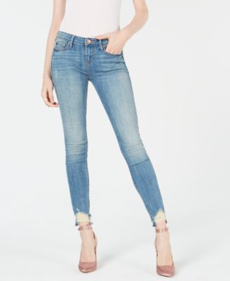 distressed hem skinny jeans