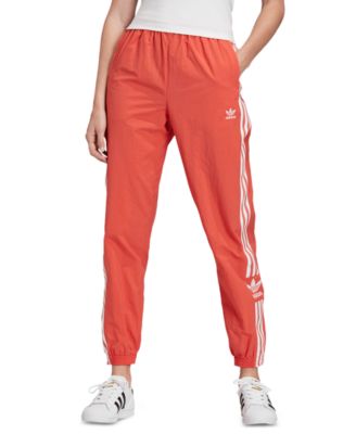 orange adidas pants womens